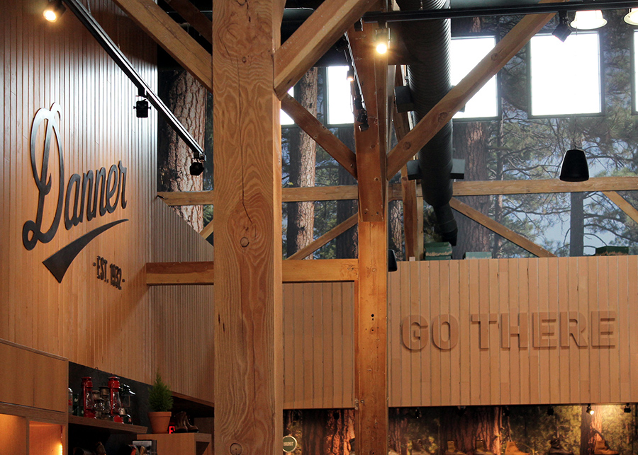 Hardwood planks line the shop's walls, a “Go There” sign sits above the shoe display and the Danner Logo behind the  counter